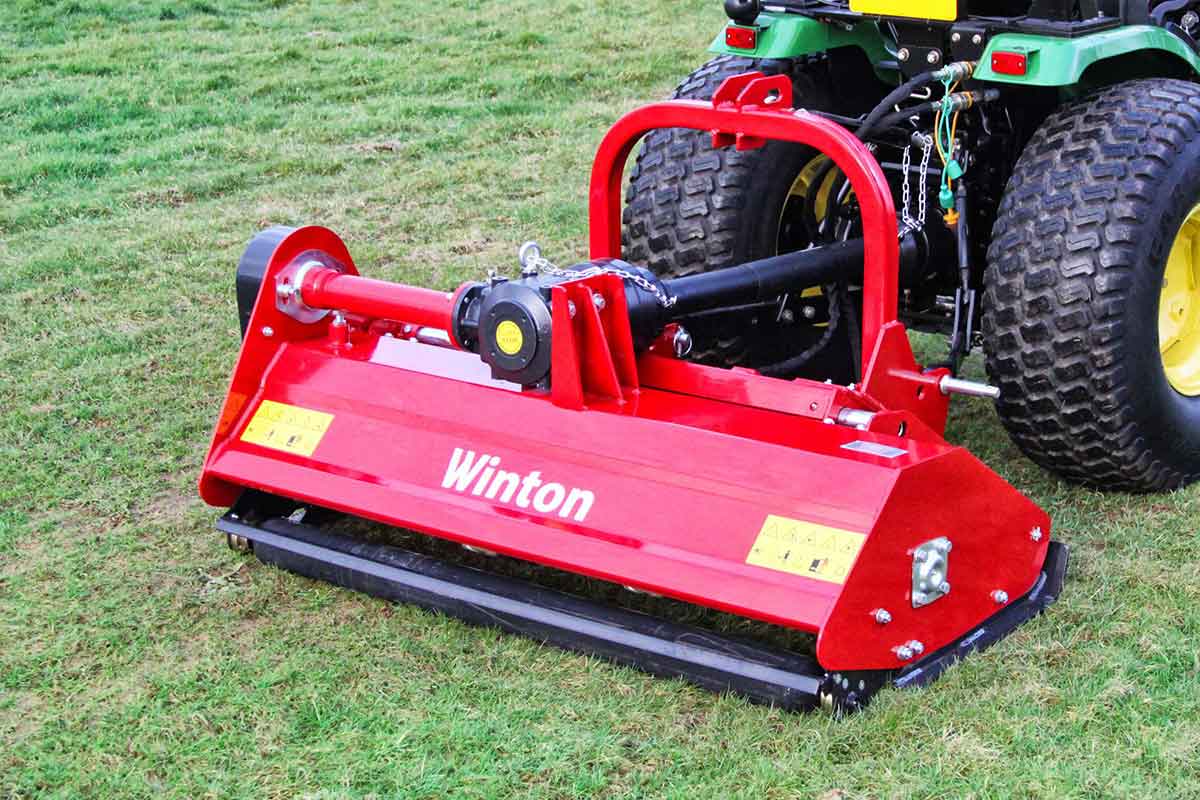 Winton W-HF145 hydraulic side-shift flail mower attached to a compact tractor